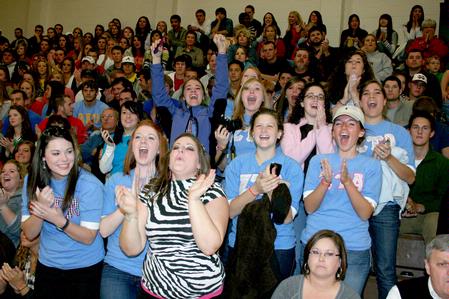 Zeta Tau Alpha sorority sisters cheer as Emily Logan, senior music performance major and a fellow ZTA, is crowned homecoming queen. - Photo by Deanna Santangelo