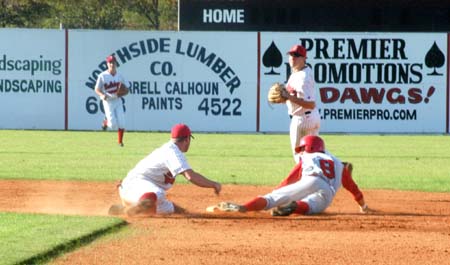 Jason Johnson (8) uses a nifty slide to avoid the tag for a stolen base. - Photo by Steven Aldridge