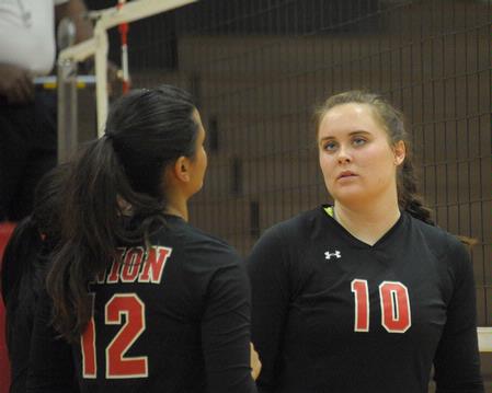 Shelby Swink (10) talks to Marcela Madeira between plays.  - Photo by Morris Abernathy