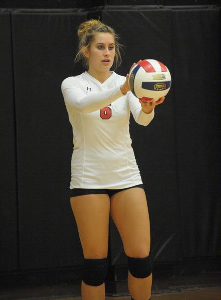 Kelsey Duling prepares to serve the ball. - Photo by Morris Abernathy