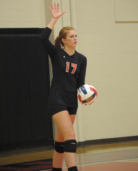 Anna Sims prepares to serve. - Photo by Morris Abernathy