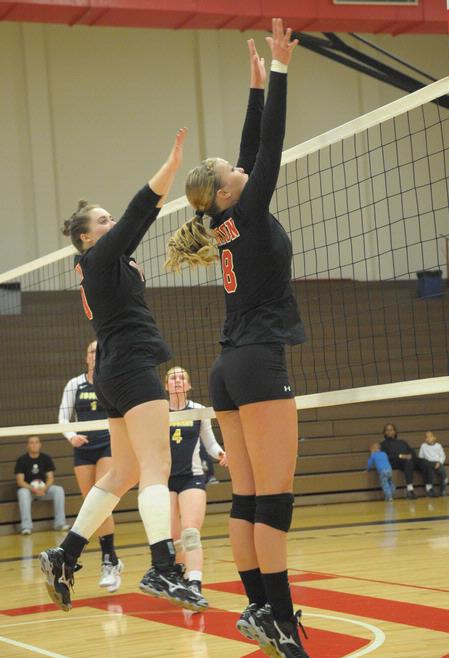Shelby Swink and Emmie Mososki go up for a block. - Photo by Morris Abernathy