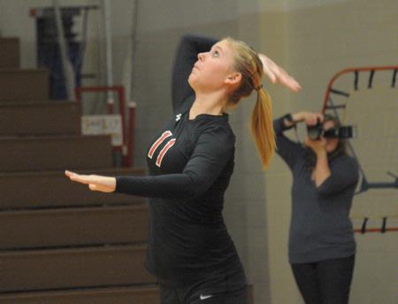 Lauren Sprouse serves the ball. - Photo by Morris Abernathy
