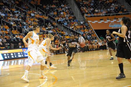 Lavanda Ross drives through a group of Lady Vols players during the exhibition game in Knoxville. - Photo by Morris Abernathy