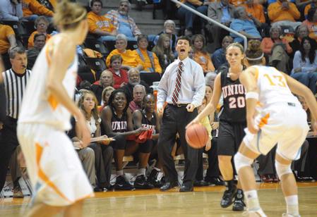 Kayla Hudson gets some coaching from Mark Campbell, head women's basketball coach, as she runs a play against the Lady Vols.  - Photo by Morris Abernathy