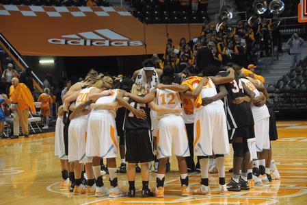 The Lady Bulldogs gather in prayer with the Lady Vols after the exhibition game played in Knoxville.  - Photo by Morris Abernathy