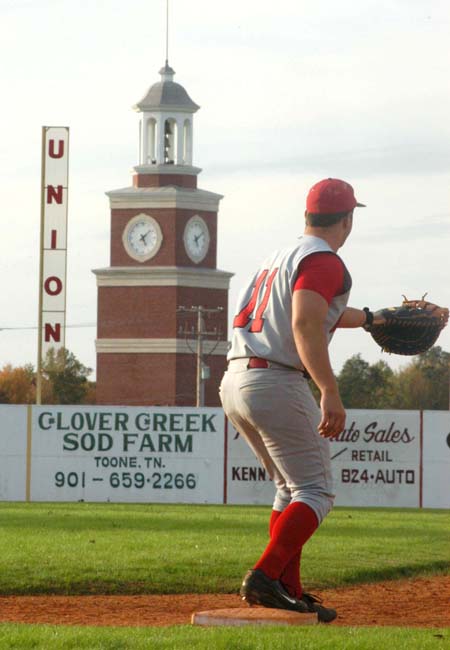 Senior first baseman Josh Allen takes a throw to record the out.  Union's Miller Tower is seen in the background. - Photo by Steven Aldridge