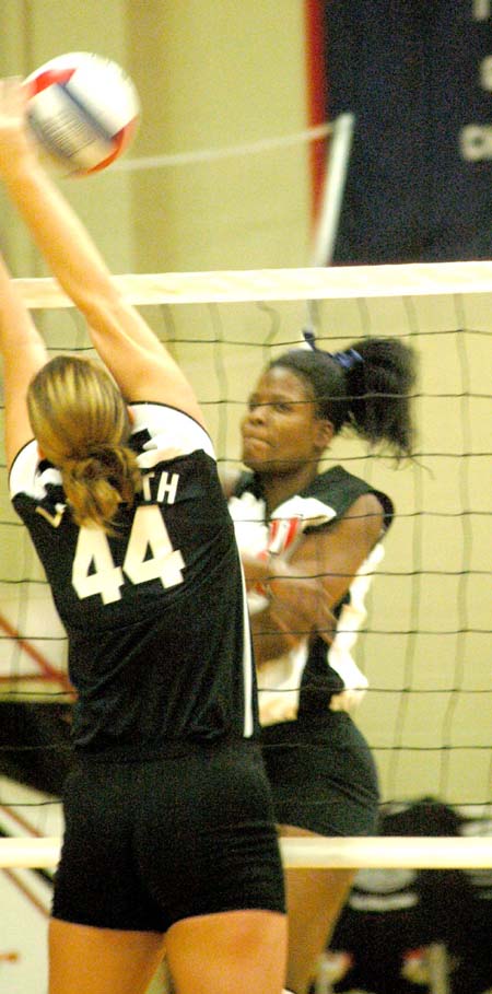 Junior hitter Gladys Wandera blasts a shot threw an attempted block in Union's 3-0 win over Lambuth. - Photo by Steven Aldridge