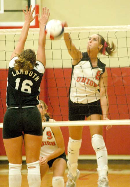 Jennie Glassey (8) gets one of her kills in Union's 3-0 win over Lambuth.  Kelly Huffines (9) for Union looks on. - Photo by Steven Aldridge