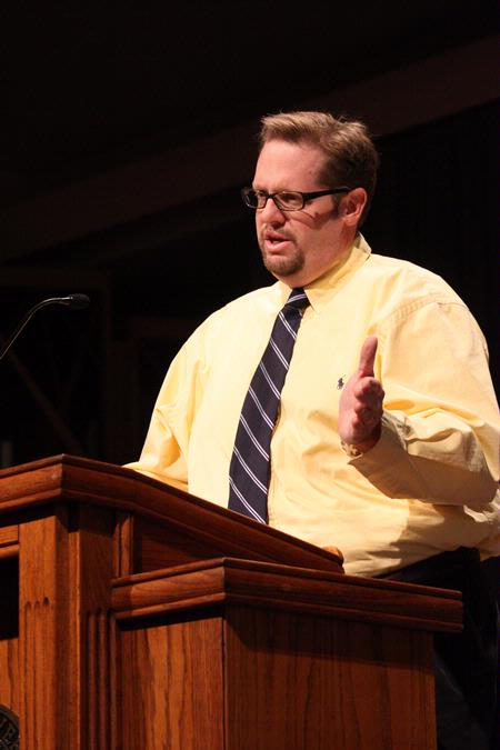 Hunter Baker, associate professor of political science, addresses the student body and visiting students during the preview day chapel.  - Photo by Ebbie Davis
