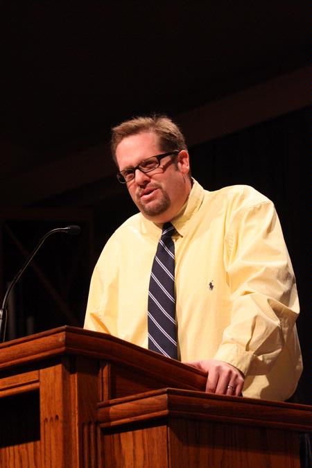 Hunter Baker, associate professor of political science, speaks during chapel.  - Photo by Ebbie Davis