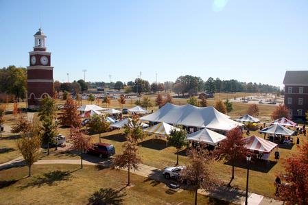 Union's Great Lawn is filled with people enjoying various homecoming activities including Arts in the Park and Tailgating.  - Photo by Ebbie Davis