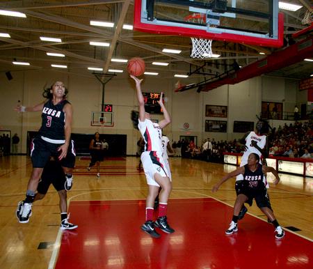 LaTesa McLaughlin shoots in the 2nd round Rotary Classic game against Azusa Pacific. The Lady Bulldogs won the game 61-50. - Photo by Deanna Santangelo