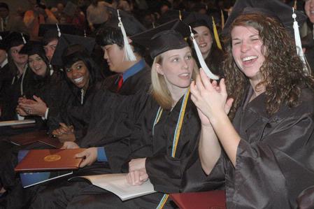 Students show excitement as the graduation ceremony comes to a close.  - Photo by Morris Abernathy