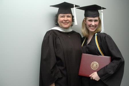 Ashley Blair, assistant professor of communication arts, and Union graduate Rachael Kapavik pose together after the December graduation ceremony. - Photo by Beth Spain