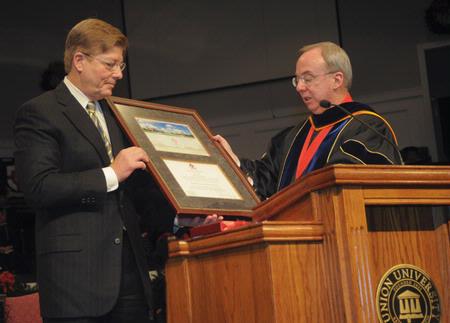 David S. Dockery (right), university president, presents the Robert E. Craig Service Award to Gary Grisham during the 2010 Fall Commencement Services.  - Photo by Morris Abernathy