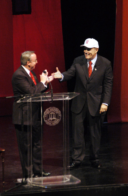 President David S. Dockery presents a Union ballcap to former New York City Mayor Rudolph Giuliani after his address at the 2003 Scholarship Banquet. - Photo by Jim Veneman