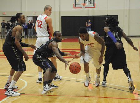 CJ Davis steals the ball from his Bethel University opponent in a game that ended victorious for the Bulldogs.  - Photo by Morris Abernathy