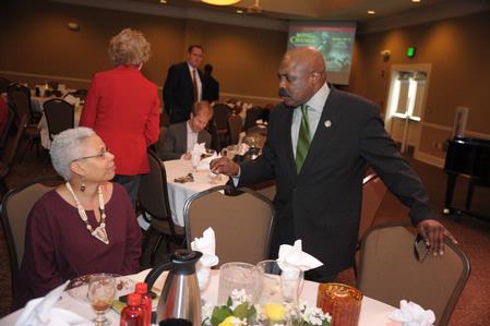 Harrell Carter greets guests of the Black History Month Program where Renita J. Weems, author and vice president of academic affairs at American Baptist College, was the guest speaker.  - Photo by Morris Abernathy