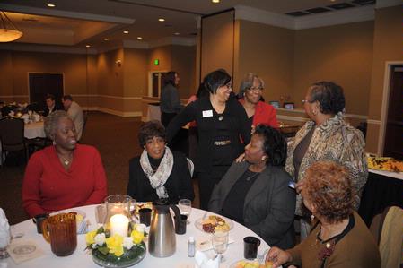 Guests of the 4th Annual Black History Month program fellowship together before hearing Renita J. Weems speak.   - Photo by Morris Abernathy
