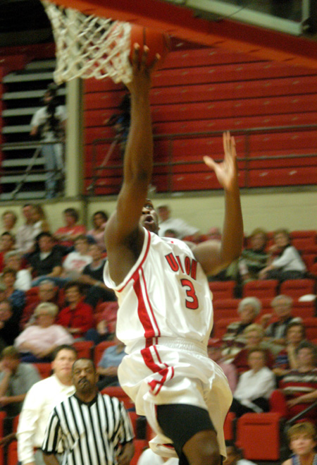 Senior guard Chima Abakwue (3) drives in for a layup in Union opening win over Williams Baptist. - Photo by Courtney Ross