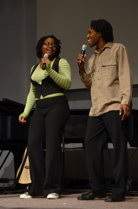 Treasure Hightower, junior dms major, and Derique Cannon, sophomore engineering major, sing a duet as part of the MOSAIC Choir performance at the beginning of chapel. - Photo by Victoria Stargel