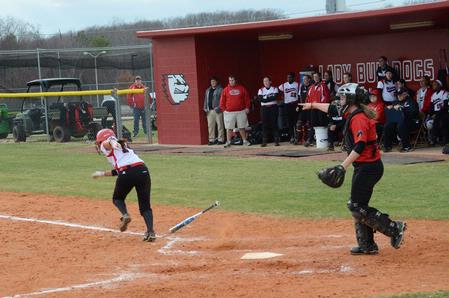 Ali Bozza, junior athletic training major, runs to first after batting for the Lady Bulldogs. The team won both games in a double header against Christian Brothers University.  - Photo by Victoria Stargel
