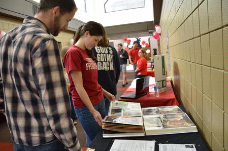 Students stop by booths in the SUB hallway during the student organization fair to learn more about various student organizations and how to join.  - Photo by Abigail Harris