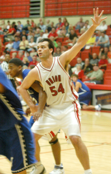 Ben Frederick, a freshman center at Union, works for position against a Williams Baptist player in the season opener. - Photo by Courtney Ross