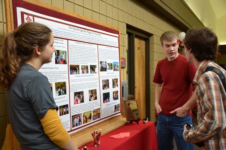 Christian Wallen, junior chemistry major, speaks to students during the student organizations fair about the ways to get involved in Union's chemistry department through organizations. - Photo by Abigail Harris