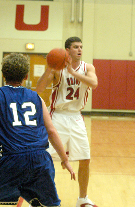 Senior guard, Will Harris (24) looks for the open man in Union's 110-71 opening win over Williams Baptist. - Photo by Courtney Ross