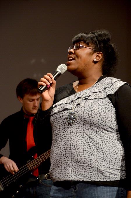 Cheraka McIntosh, sophomore nursing major, sings at the beginning of chapel. - Photo by Deanna Santangelo