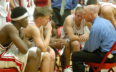 Ralph Turner, in his 10th season as head coach, talks to the Bulldogs during a timeout. - Photo by Courtney Ross