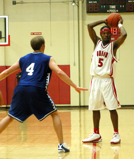 Freshman guard, Marcus Cooper (5) is in no rush to pass or shoot during the 110-71 win over Williams Baptist. - Photo by Courtney Ross