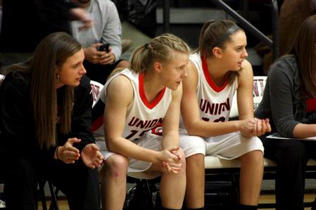The Lady Bulldog's watch and cheer on their teammates while Union plays Bethel University and wins 81-62. - Photo by Ebbie Davis