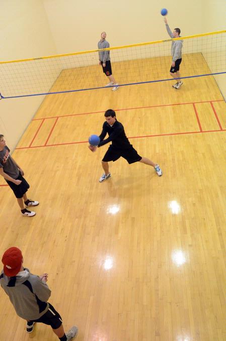 Students play intramural wall ball in the racquetball courts.  - Photo by Beth Spain
