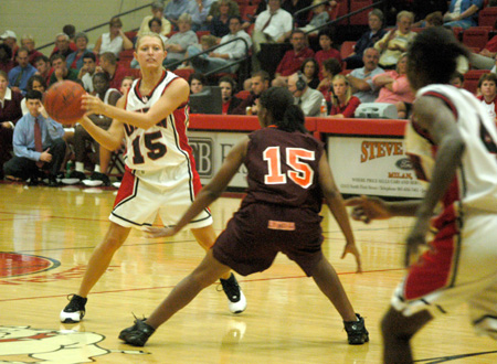 Laura Davison (15) looks to pass to the cutting Latorya Fuller (4) in a 91-64 win over Claflin. - Photo by Courtney Ross