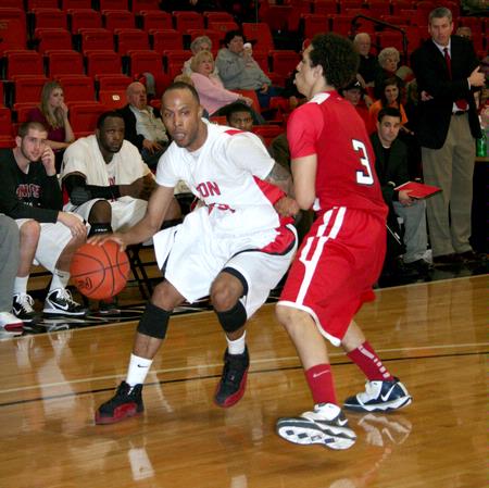 Stan McNeil runs the ball down the court during the game against Lyon College, which the Bulldogs won 73-40. - Photo by Deanna Santangelo