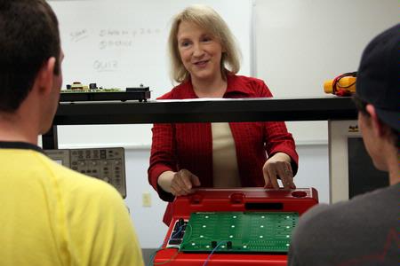 Jeanette Russ, professor of engineering, gets her students started on their circuits lab assignment. - Photo by Kristi McMurry Woody