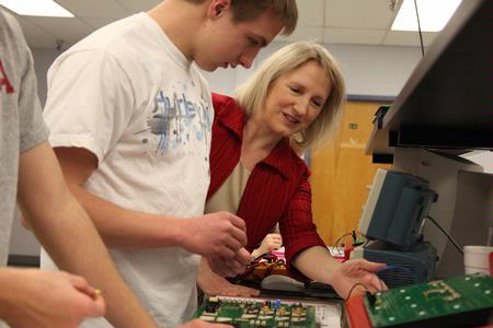 Jeanette Russ, professor of engineering, helps her students with circuits.  - Photo by Kristi McMurry Woody