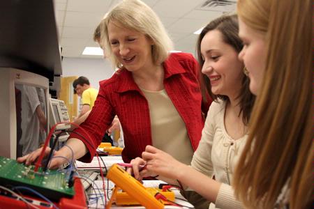 Jeanette Russ, professor of engineering, helps her students with circuits.  - Photo by Kristi McMurry Woody