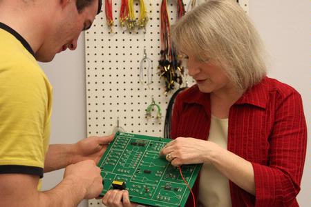 Jeanette Russ, professor of engineering, teaches her students about circuits in class.  - Photo by Kristi McMurry Woody