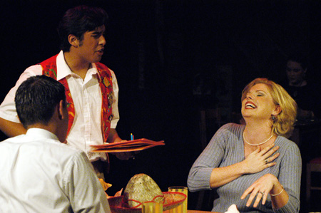 Lucas Villalpondo as Hector Hazada serves Stephen Kennedy and Emily Brown as Harvey and Sandy Gold in <i>You Have To Serve Somebody</i>. - Photo by Jim Veneman