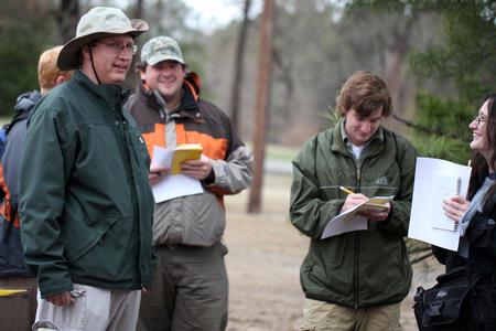 Andy Madison, associate professor of biology, talks with his conservation biology students during a trip to the West TN Research & Education Center. - Photo by Kristi McMurry Woody