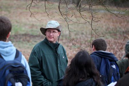 Andy Madison, associate professor of biology, takes a tour around the West TN Research & Education Center with students to observe various trees and their characteristics.  - Photo by Kristi McMurry Woody