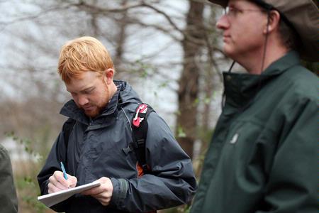 Josh Smith, senior conservation biology major, takes notes during a tour of the West TN Research & Education Center. - Photo by Kristi McMurry Woody