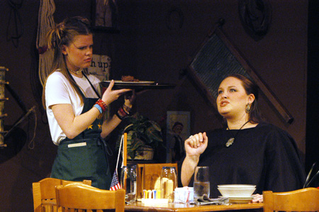 Courtney Braswell as Denny Standard serves Lindsay Young as Abilene Hipps in <i>You Have To Serve Somebody</i>. - Photo by Jim Veneman