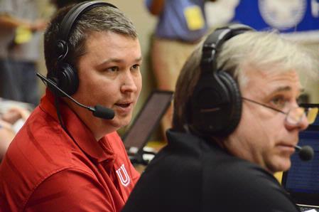 Steven Aldridge, director of sports information, commentates during the first game of the NAIA National Championship. - Photo by Beth Spain