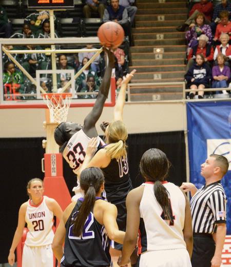 Zeinab Chan goes up against her Avila University opponent at the start of the first game of the NAIA National Championship. The Lady Bulldogs won the game 62-37 and advanced to the next round.  - Photo by Abigail Harris