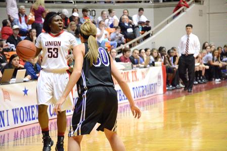 Lavanda Ross looks for a teammate open for a pass during the first game of the NAIA National Championship. The Lady Bulldogs won the game and advanced to the second round.  - Photo by Abigail Harris